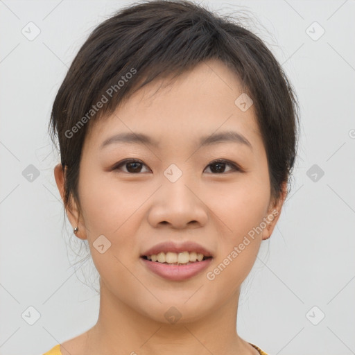 Joyful asian young-adult female with short  brown hair and brown eyes