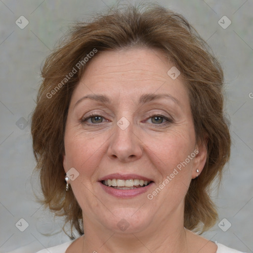 Joyful white adult female with medium  brown hair and grey eyes