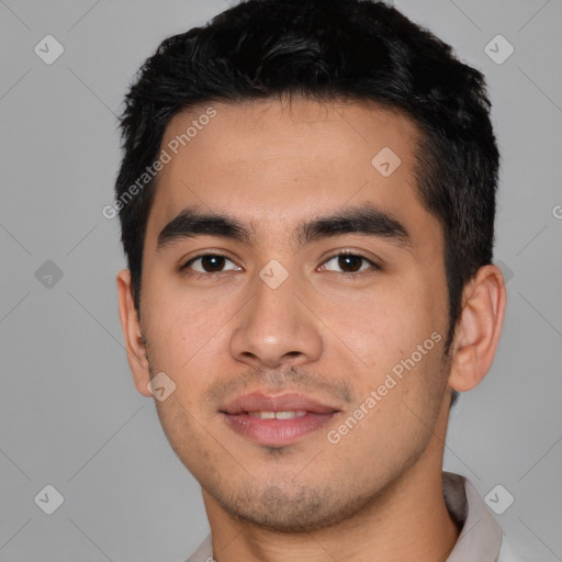 Joyful white young-adult male with short  black hair and brown eyes