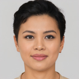 Joyful asian young-adult female with short  brown hair and brown eyes