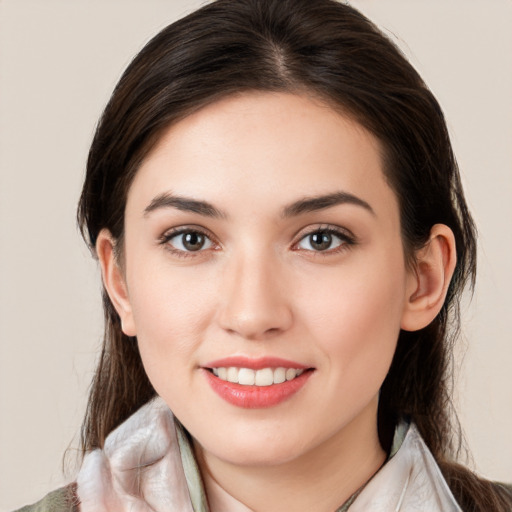 Joyful white young-adult female with medium  brown hair and brown eyes