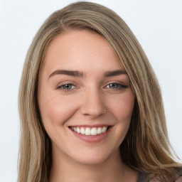 Joyful white young-adult female with long  brown hair and green eyes