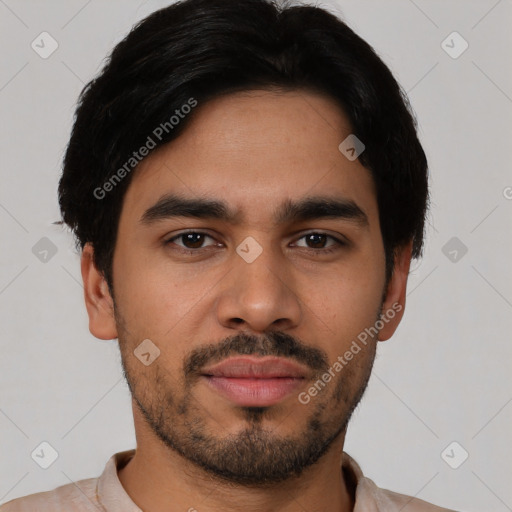 Joyful latino young-adult male with short  black hair and brown eyes