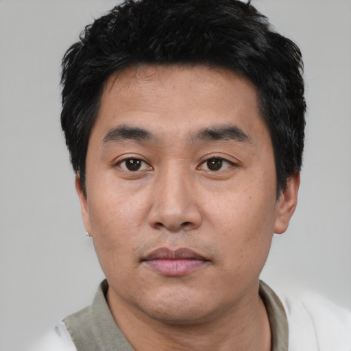 Neutral asian young-adult male with short  black hair and brown eyes