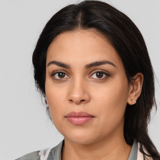 Neutral latino young-adult female with medium  black hair and brown eyes