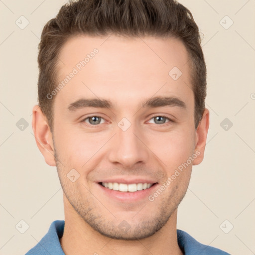 Joyful white young-adult male with short  brown hair and brown eyes