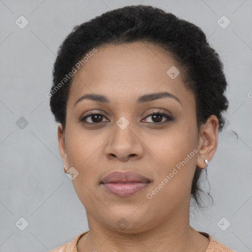 Joyful black young-adult female with short  brown hair and brown eyes