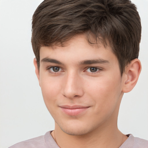 Joyful white child male with short  brown hair and brown eyes