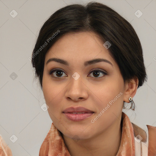 Joyful asian young-adult female with medium  brown hair and brown eyes