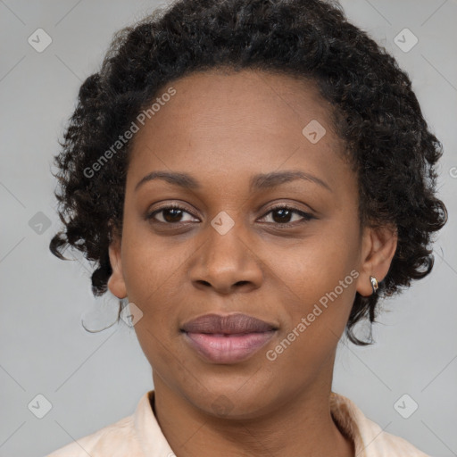 Joyful black adult female with short  brown hair and brown eyes