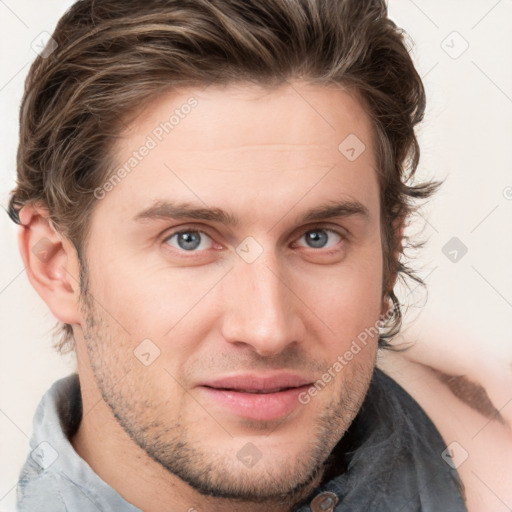 Joyful white young-adult male with short  brown hair and blue eyes