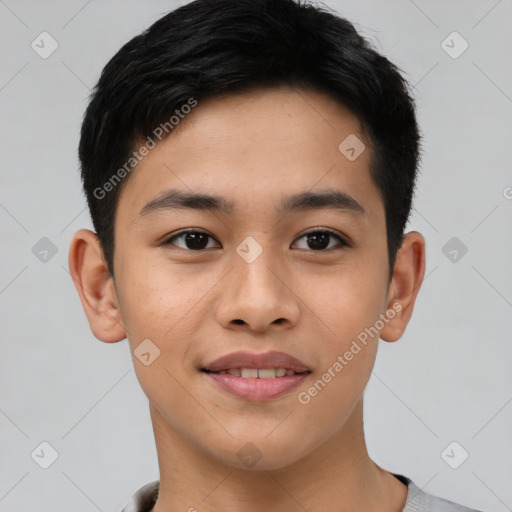 Joyful asian young-adult male with short  brown hair and brown eyes