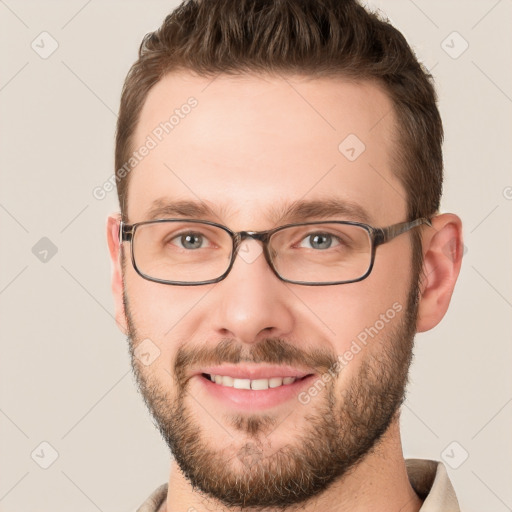 Joyful white young-adult male with short  brown hair and brown eyes