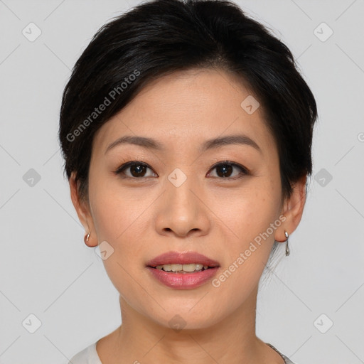 Joyful asian young-adult female with short  black hair and brown eyes