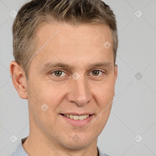 Joyful white adult male with short  brown hair and brown eyes