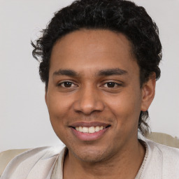 Joyful latino young-adult male with short  brown hair and brown eyes