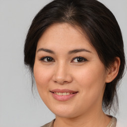 Joyful white young-adult female with medium  brown hair and brown eyes