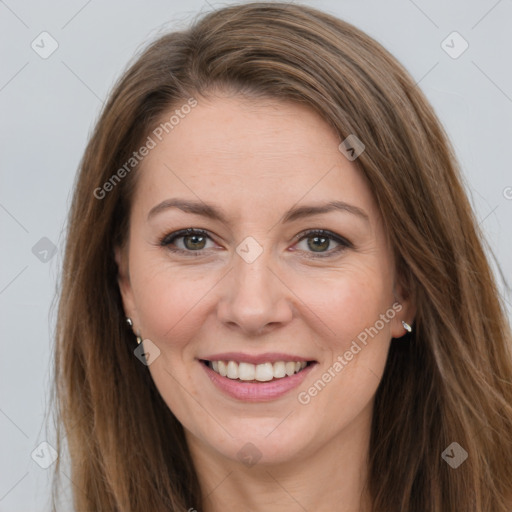 Joyful white adult female with long  brown hair and brown eyes