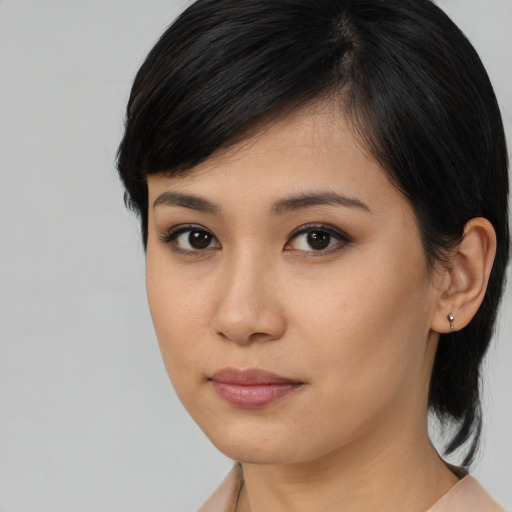 Neutral asian young-adult female with medium  brown hair and brown eyes