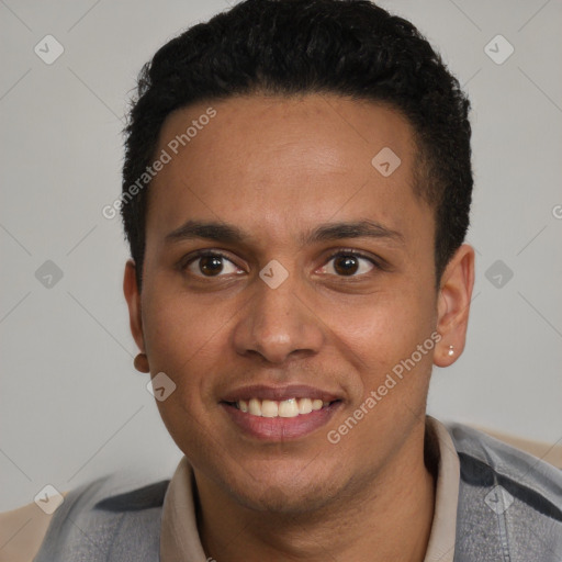 Joyful latino young-adult male with short  black hair and brown eyes