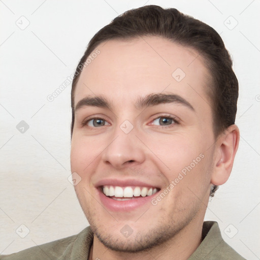 Joyful white young-adult male with short  brown hair and brown eyes