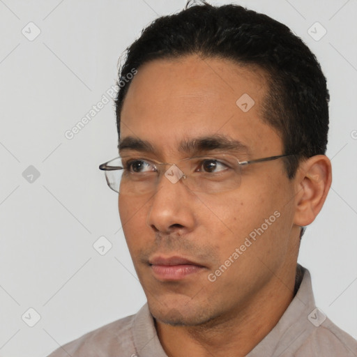 Neutral white young-adult male with short  black hair and brown eyes