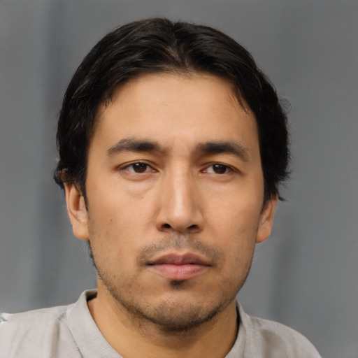 Neutral asian young-adult male with short  black hair and brown eyes