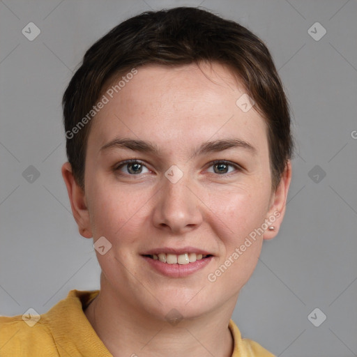 Joyful white young-adult female with short  brown hair and grey eyes