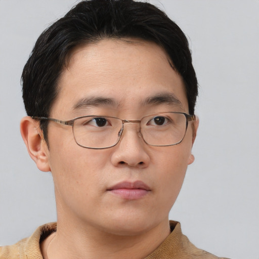 Neutral asian young-adult male with short  brown hair and brown eyes