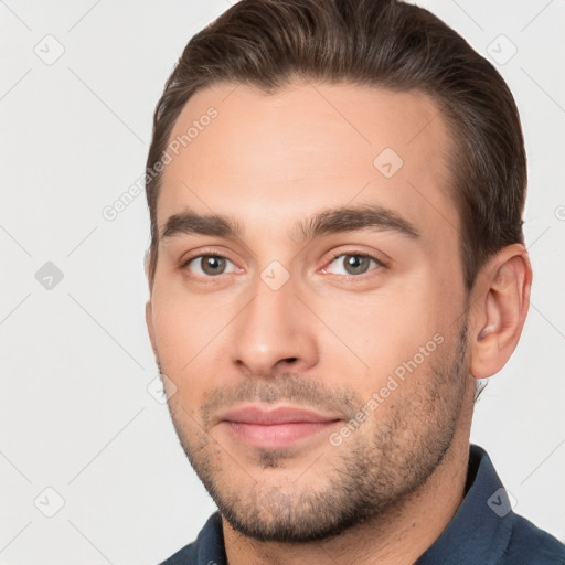 Joyful white young-adult male with short  brown hair and brown eyes