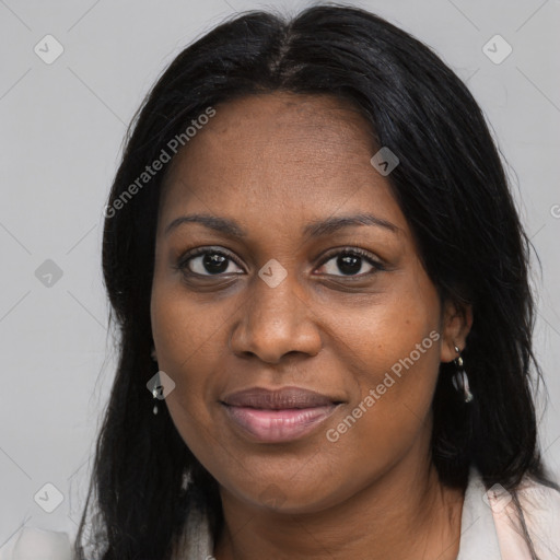 Joyful black young-adult female with long  brown hair and brown eyes
