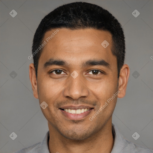 Joyful latino young-adult male with short  black hair and brown eyes