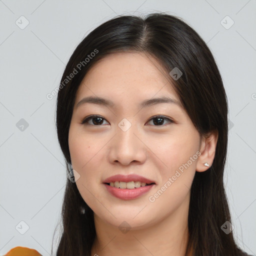 Joyful asian young-adult female with long  brown hair and brown eyes