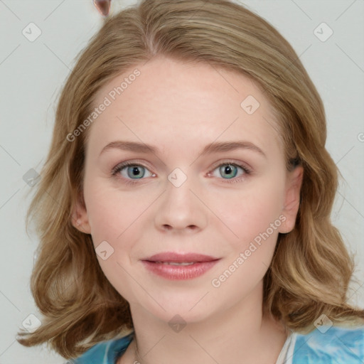 Joyful white young-adult female with medium  brown hair and blue eyes