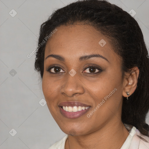 Joyful black young-adult female with medium  black hair and brown eyes