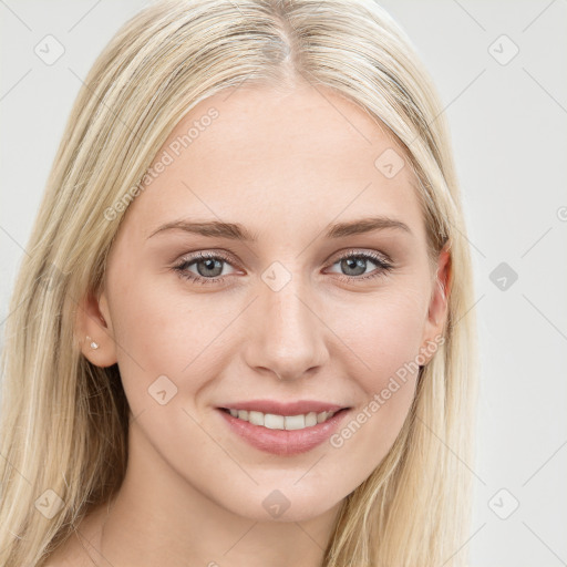 Joyful white young-adult female with long  brown hair and blue eyes