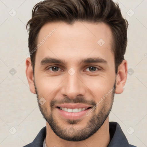 Joyful white young-adult male with short  brown hair and brown eyes