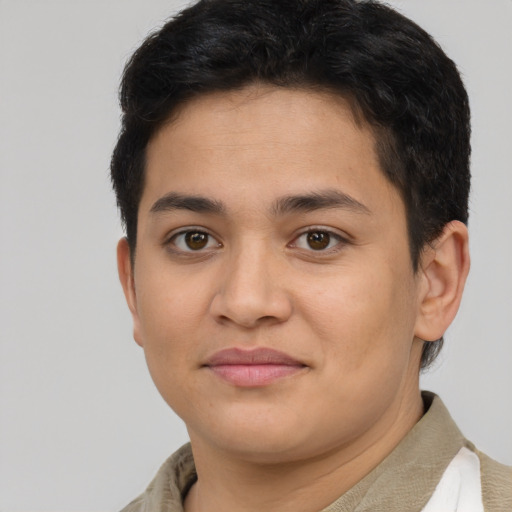 Joyful latino young-adult male with short  brown hair and brown eyes