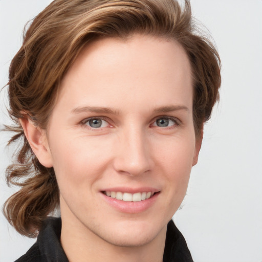 Joyful white young-adult female with medium  brown hair and blue eyes