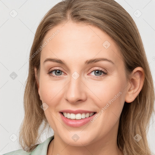 Joyful white young-adult female with long  brown hair and blue eyes