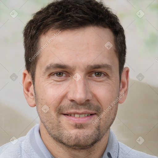 Joyful white adult male with short  brown hair and brown eyes