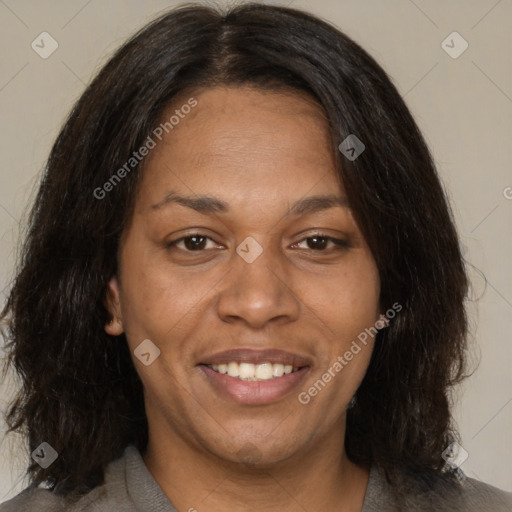 Joyful black adult female with medium  brown hair and brown eyes