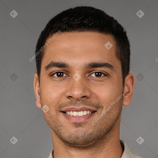 Joyful latino young-adult male with short  brown hair and brown eyes