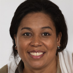 Joyful white adult female with medium  brown hair and brown eyes