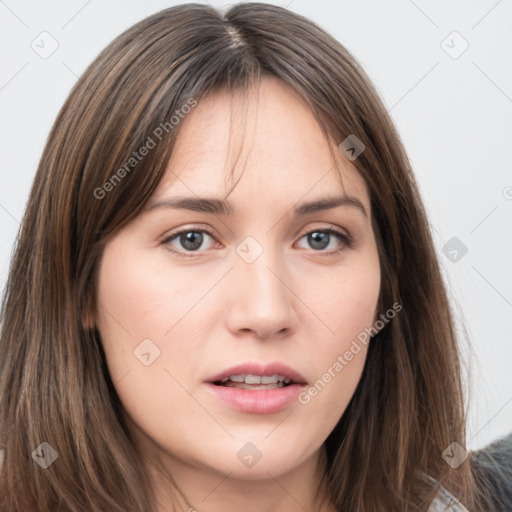 Neutral white young-adult female with long  brown hair and brown eyes