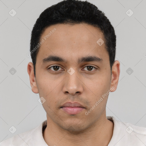 Neutral latino young-adult male with short  black hair and brown eyes