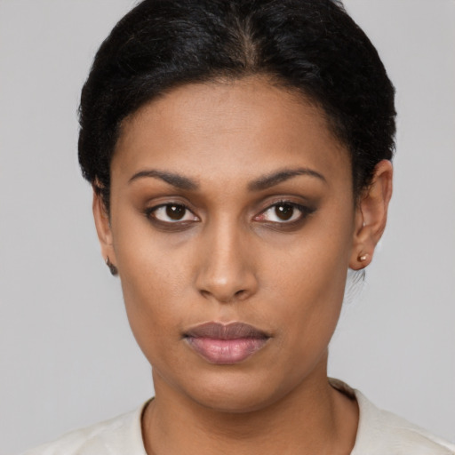 Neutral latino young-adult female with short  black hair and brown eyes