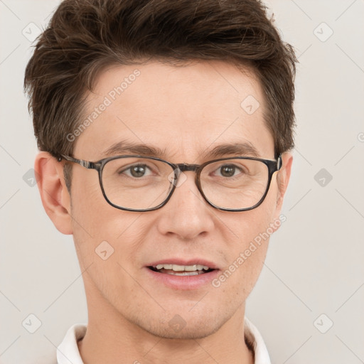 Joyful white adult male with short  brown hair and grey eyes