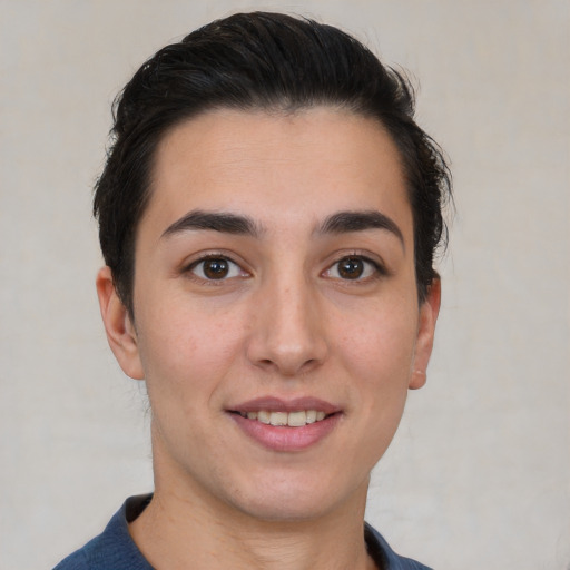 Joyful white young-adult female with short  black hair and brown eyes