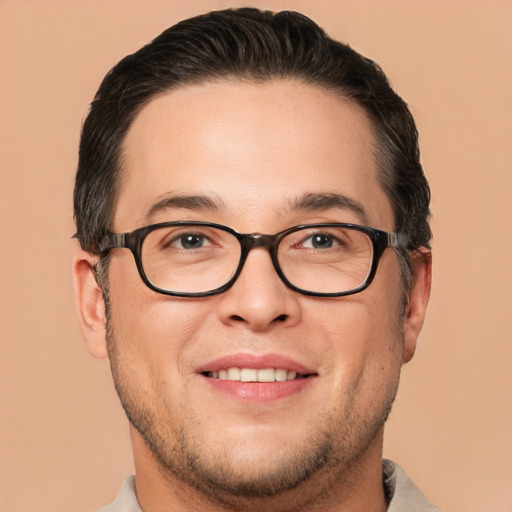 Joyful white young-adult male with short  brown hair and brown eyes